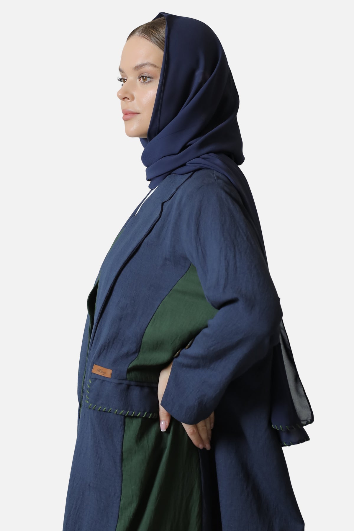Blue and green linen abaya with two-tone details — full view