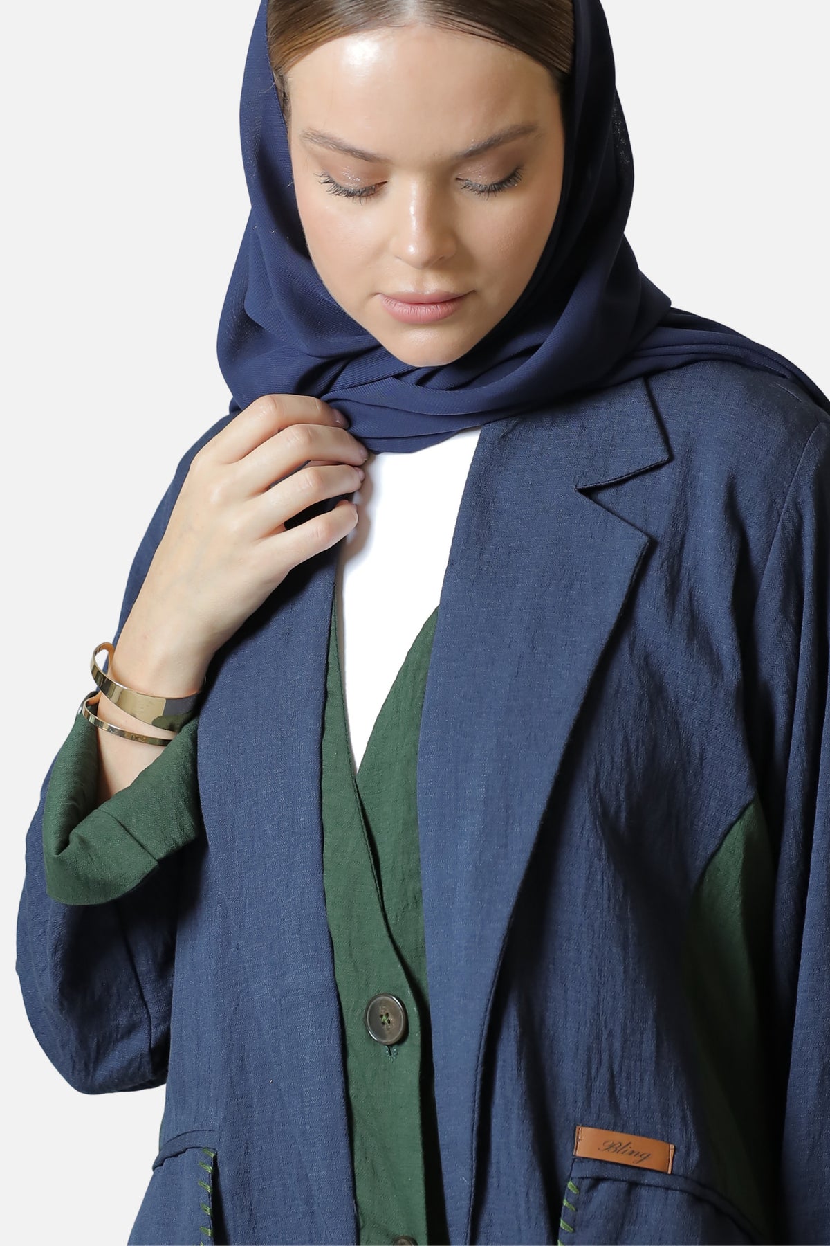 Blue and green linen abaya — two-tone design detail