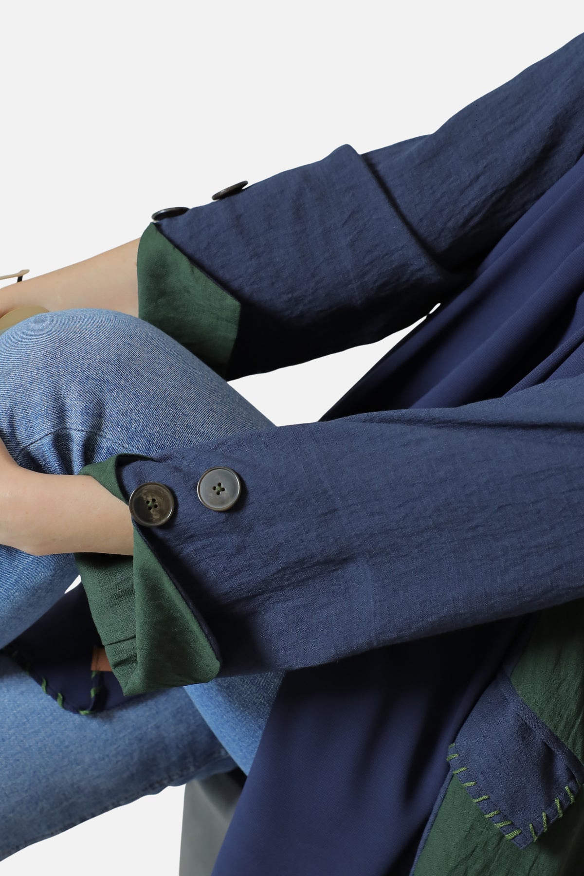 Blue and green linen abaya — sleeve button and contrasting edge detail