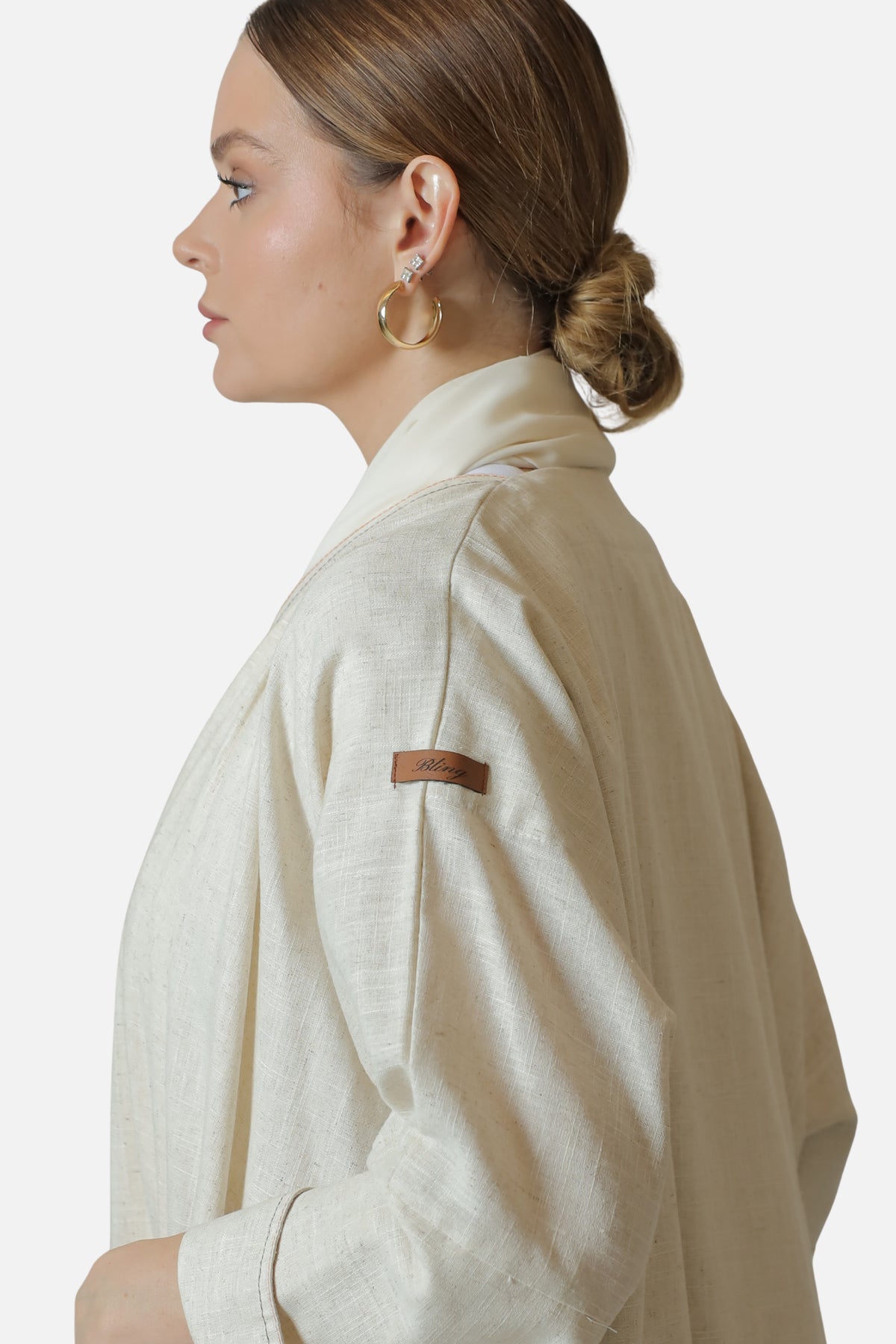 Ivory linen abaya — shoulder and sleeve detail