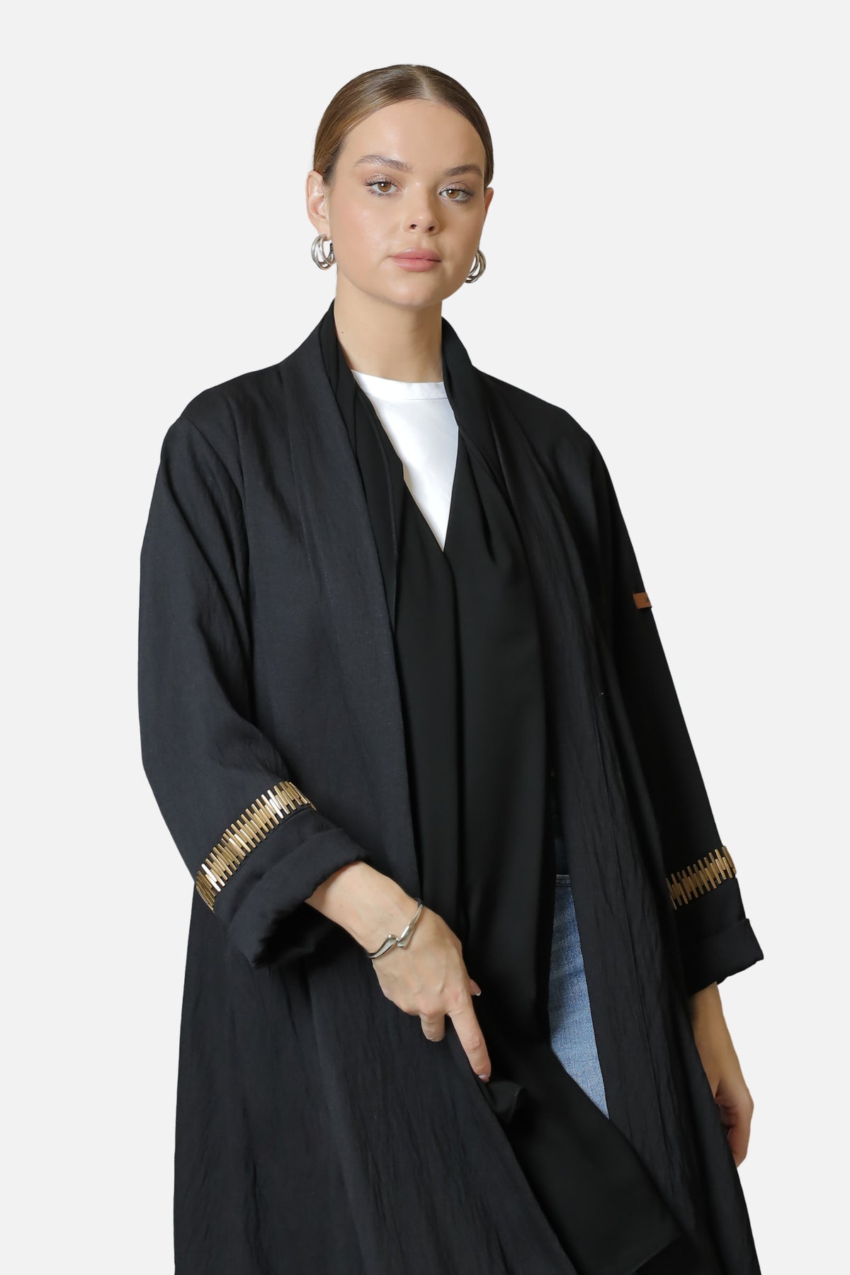 Black linen abaya with gold-tone sleeve details — front view