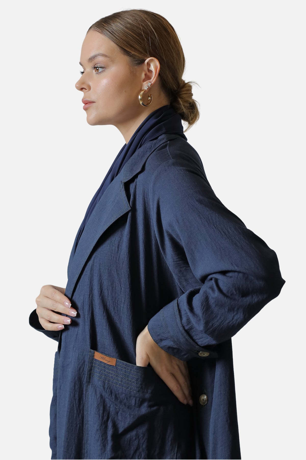 Navy linen abaya with side button details — side profile view