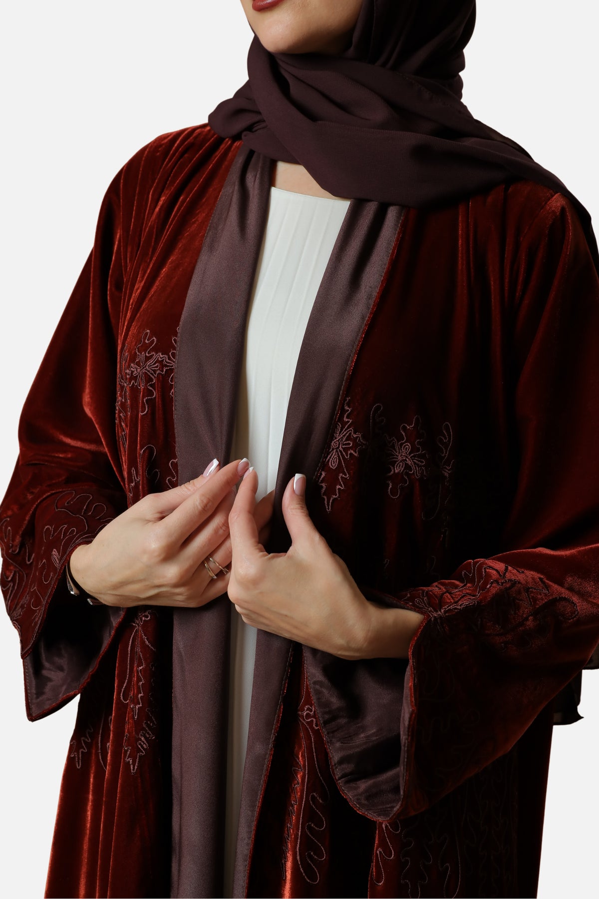 Brick red velvet abaya with Moroccan embroidery — front detail with shaila