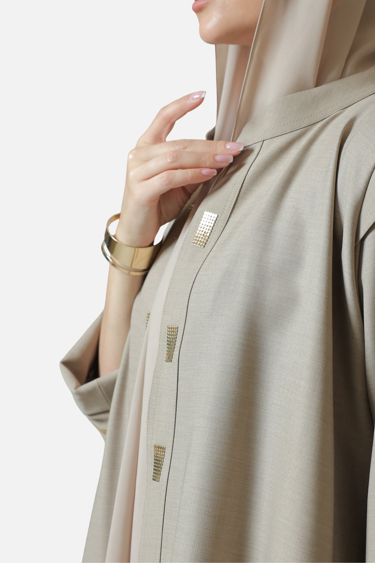 Beige cotton abaya — gold-tone front and cuff details