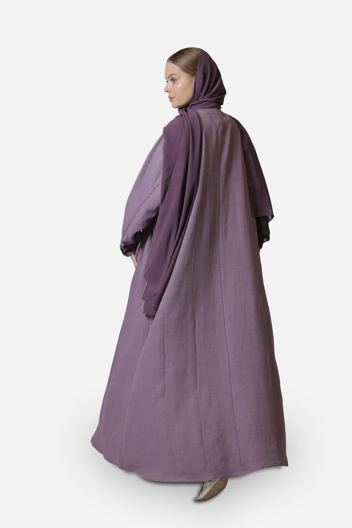 Full-length rear three-quarter view of the purple cotton abaya with shaila.