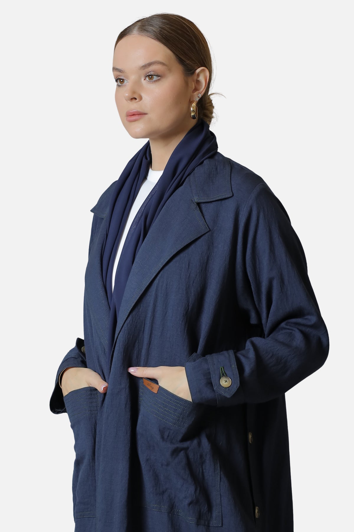 Navy linen abaya with side button details — front view
