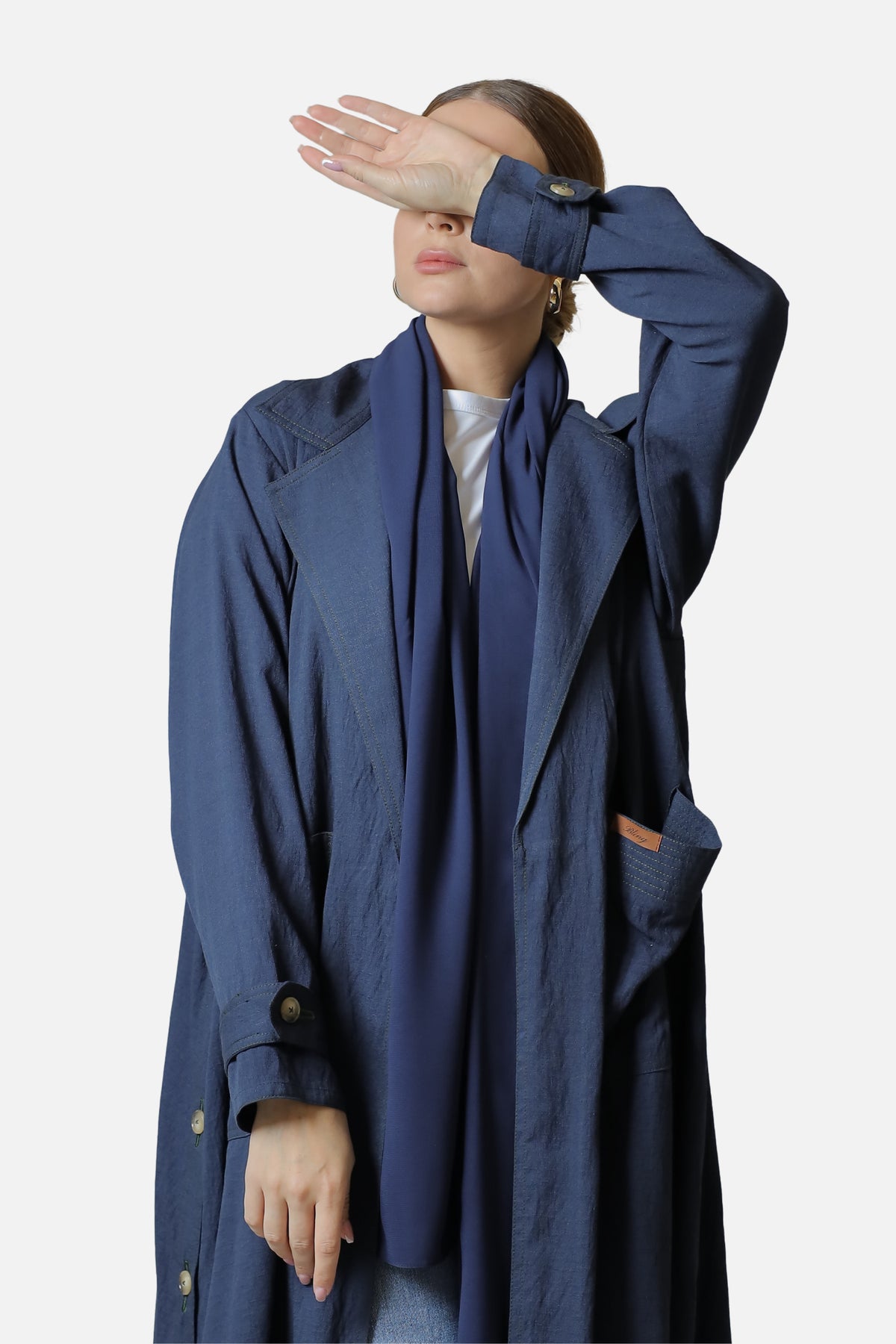 Navy linen abaya with side button details — front styling view