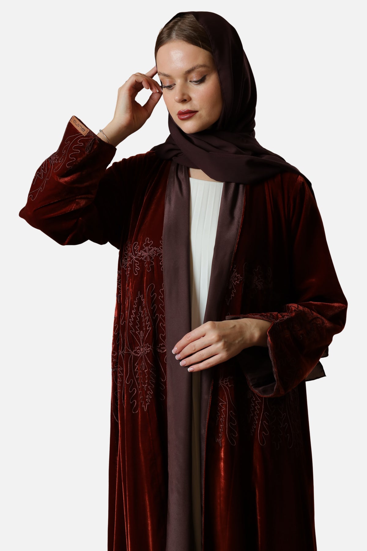 Brick red velvet abaya with Moroccan embroidery — upper body front view