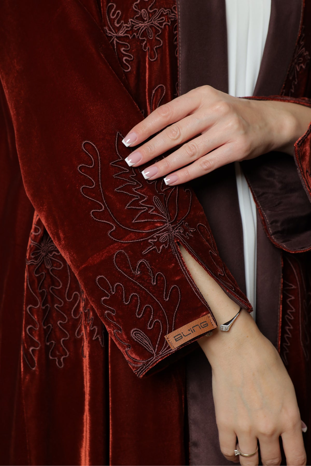Brick red velvet abaya — sleeve embroidery detail