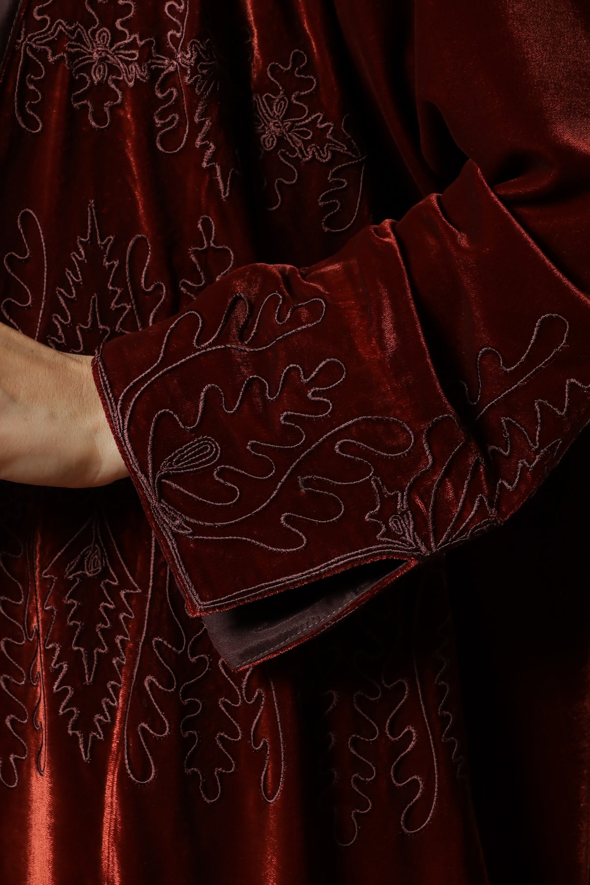 Brick red velvet abaya — cuff and embroidery detail